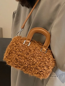 Caramel fuzzy faux fur Boston bag with leather handles shown on model for autumn winter