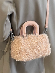 Pink faux fur Boston bag with lamb wool texture and round handles for women