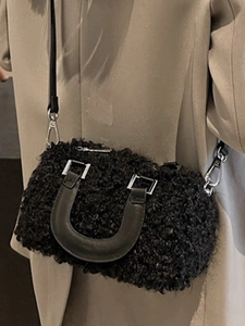 Chic black fuzzy faux fur Boston crossbody bag with leather handles and silver hardware