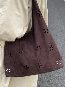 Fashionable dark brown suede shoulder bag with laser-cut hollow floral patterns