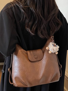 Minimalist brown retro leather hobo shoulder bag with a cute white plush pendant charm