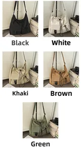 Detail view of large drawstring bucket bags in five colors with utility buckles