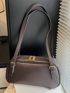 Chic dark brown vintage baguette bag with gold zippers and adjustable shoulder straps