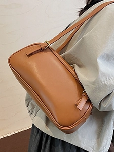 Minimalist brown leather baguette shoulder bag with adjustable strap for women