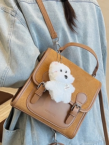 Brown retro crossbody bag with quilted details and plush puppy charm for women