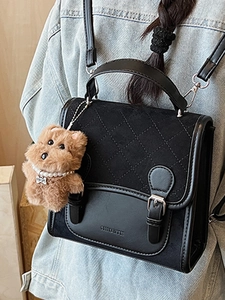 Chic black patchwork small backpack with quilted flap and cute plush charm for women
