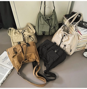Detail showing high-capacity drawstring bucket bags in five colors with functional pockets