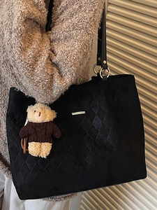 Minimalist black tote bag with diamond quilting and cute teddy bear charm for women