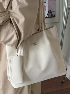 Minimalist creamy white large tote bag with metallic logo for stylish women commute