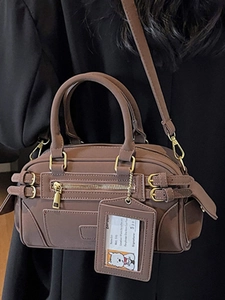 Vintage brown Boston underarm bag with gold buckles and adjustable strap for women