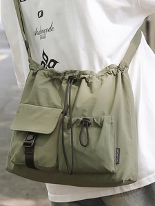 Olive green nylon drawstring bucket bag with tactical multi-pockets for street style
