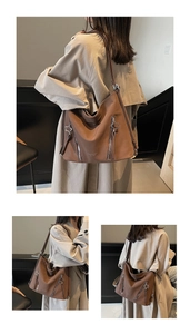 Detail view of large brown tote bag showing side zippers and star pendant details