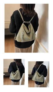 Detail of sage green tote backpack with star zippers and soft matte texture finish