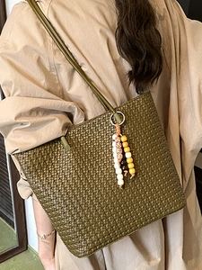 Retro woven tote bag in olive green with wooden bead charm and long shoulder straps
