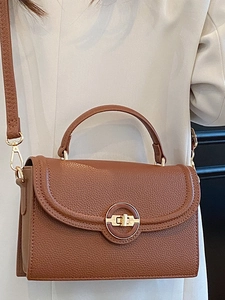 Fashionable brown litchi grain leather crossbody bag with elegant gold round lock detail