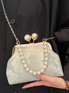 Elegant mint green floral jacquard bag with large pearl handle and gold chain strap