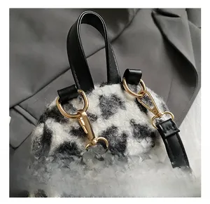 Close-up of leopard print faux fur material with premium golden metal hook and leather strap