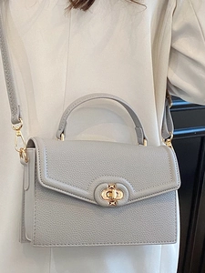 Chic gray litchi texture handbag with top handle and gold twist lock closure for women