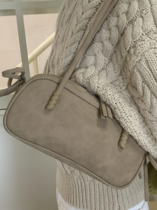 Chic beige frosted Boston shoulder bag with unique spiral knot detail and large capacity