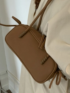 Minimalist matte brown shoulder bag with woven knot detail and large capacity