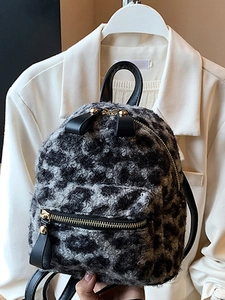Mini leopard print plush backpack for women featuring grey faux fur and gold hardware