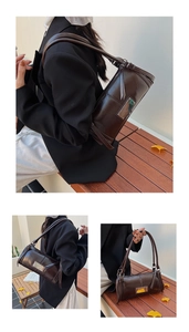 Close-up of deep coffee glossy leather baguette bag with silver metal plate detail