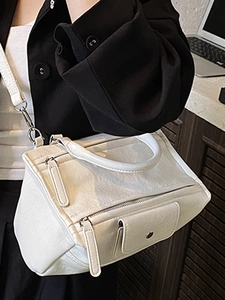 French minimalist white leather handbag with structured design and silver hardware details
