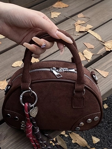 Minimalist dark brown suede leather shoulder bag with metallic heart charm decoration