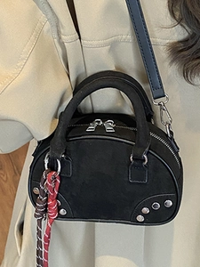 Minimalist black boston bag in suede texture with silver studs and woven strap detail