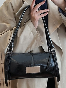 Vintage glossy black shoulder bag with silver hardware for casual autumn fashion style
