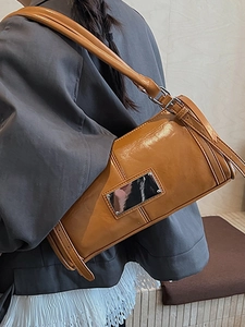 Vintage caramel glossy leather shoulder bag for women with silver metal plaque detail