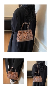 Detailed view of leopard print bucket bag with brown leather trim and metal hardware buckle