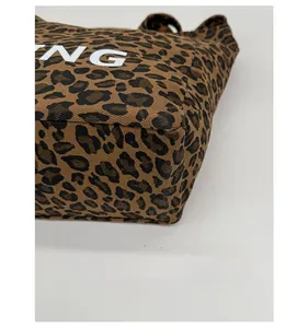 Detail shot of the reinforced double stitching on the leopard print canvas tote bag