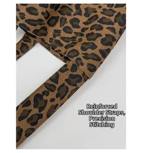 Close-up of reinforced straps and precision stitching on the leopard canvas tote bag
