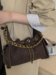 Vintage dark brown suede crossbody bag with diamond quilting and gold chain strap