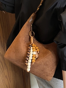 Vintage brown quilted suede shoulder bag with retro bead tassel and adjustable strap