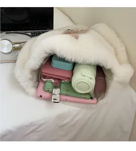 Detail view of the spacious interior of this white plush faux fur bucket bag for women