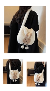 Detail showing the soft white plush texture and 3D rabbit design of the bucket bag