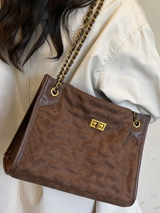 Vintage brown quilted suede tote bag with golden chain strap and metallic clasp