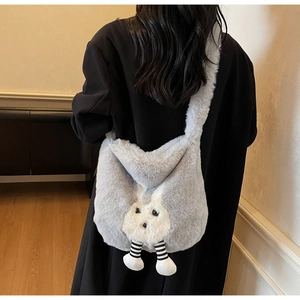 Plush crossbody bucket bag with cartoon legs and fluffy texture shown on model