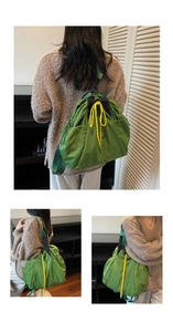 Detail view of green drawstring backpack showing nylon texture and yellow cord accents