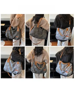 Detail view of large grey marble canvas tote bag with brown leather straps for women