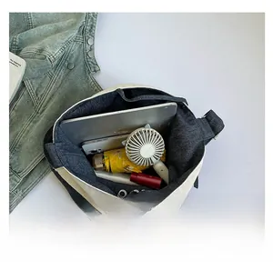 Top view showing the spacious interior of this large canvas tote bag with daily items