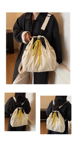 Detail of cream nylon backpack with yellow drawstrings and wide comfortable straps