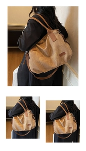 Close-up of khaki canvas tote bag with wide strap and vintage leather patch detail