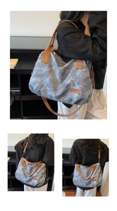 Detail of vintage washed denim tote bag showing adjustable straps and textured surface