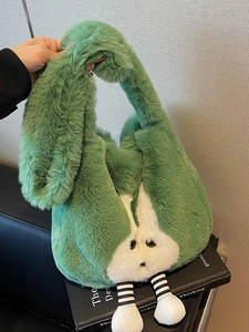 Green faux fur bucket bag with plush rabbit face and striped legs for winter fashion