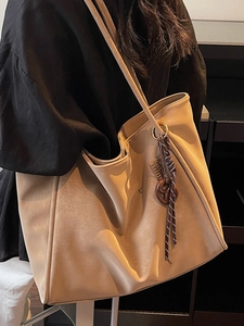 Large beige vintage tote bag with wooden charm and woven strap for office commute