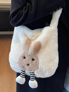 Plush white rabbit crossbody bag with striped legs on black suit background