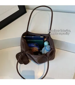 Top-down view of large tote bag interior showing spacious storage for tablet and bottles